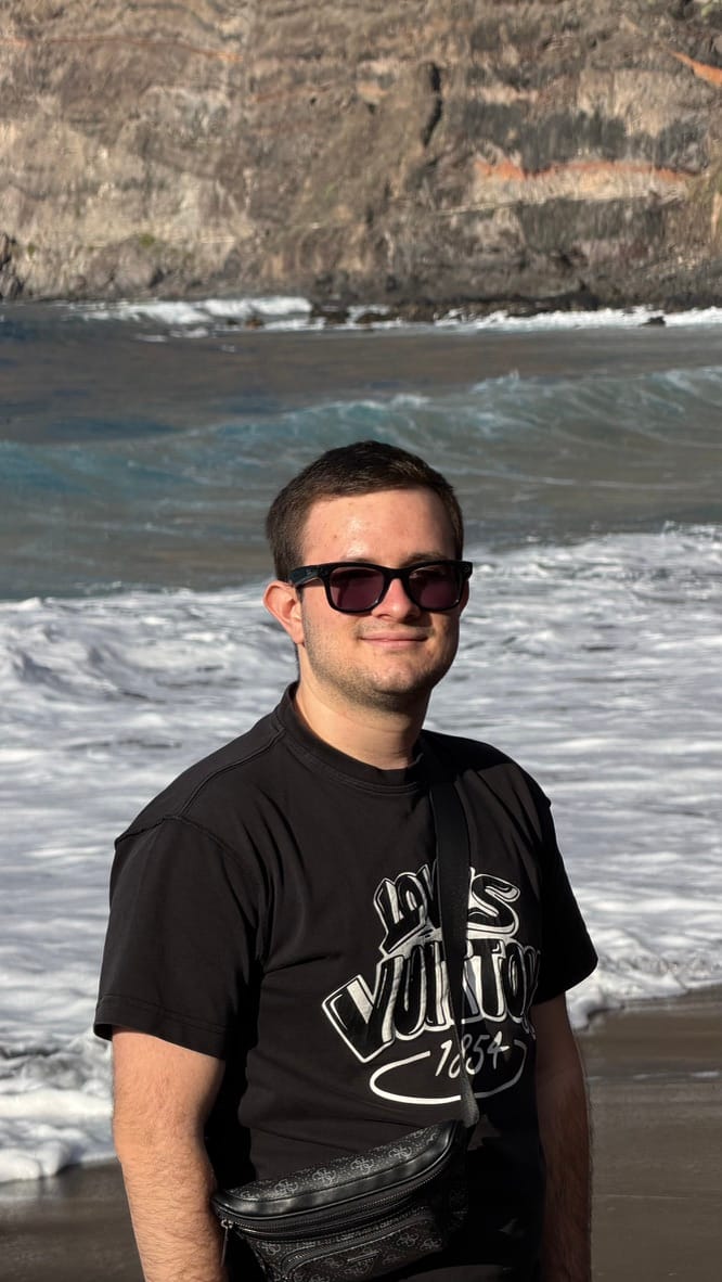 Arkadii Zon, software engineer, smiling in a half-length portrait